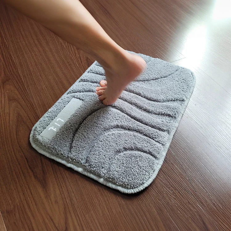 A bare foot stepping onto the Ruggie 2.0 mat to silence the alarm